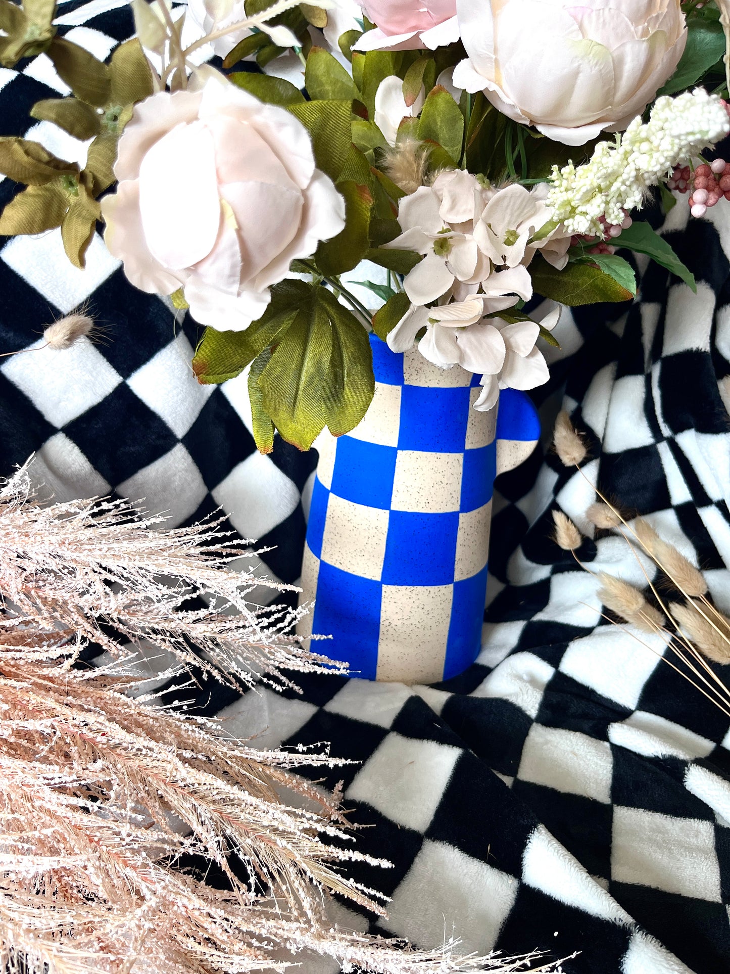Blue checker utensil holder vase