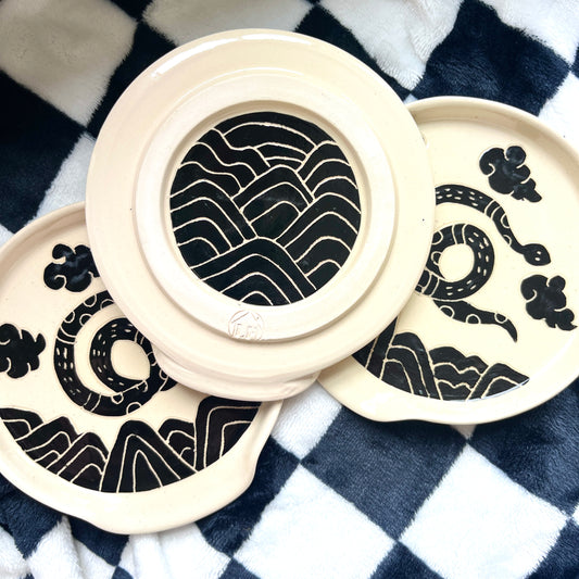 Ancient snake spoon rest